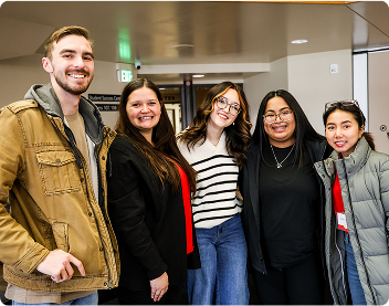 group of happy students together posing for a picture