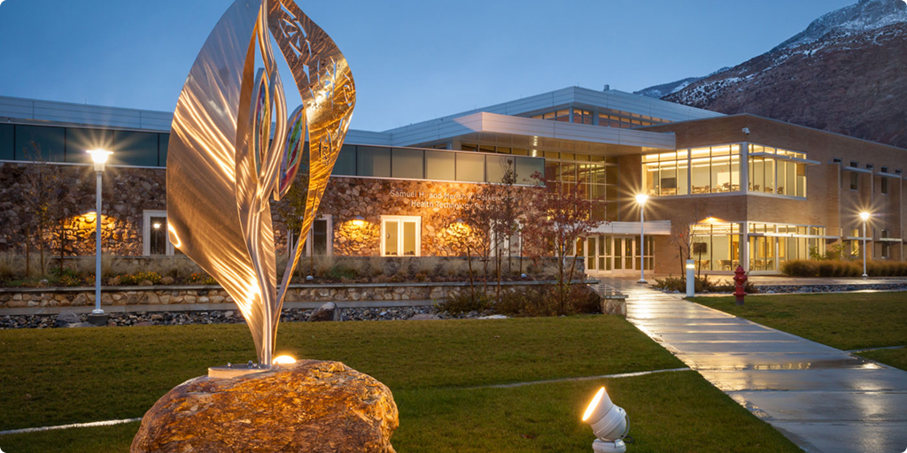 the foundation building from the front in the evening with the lights on