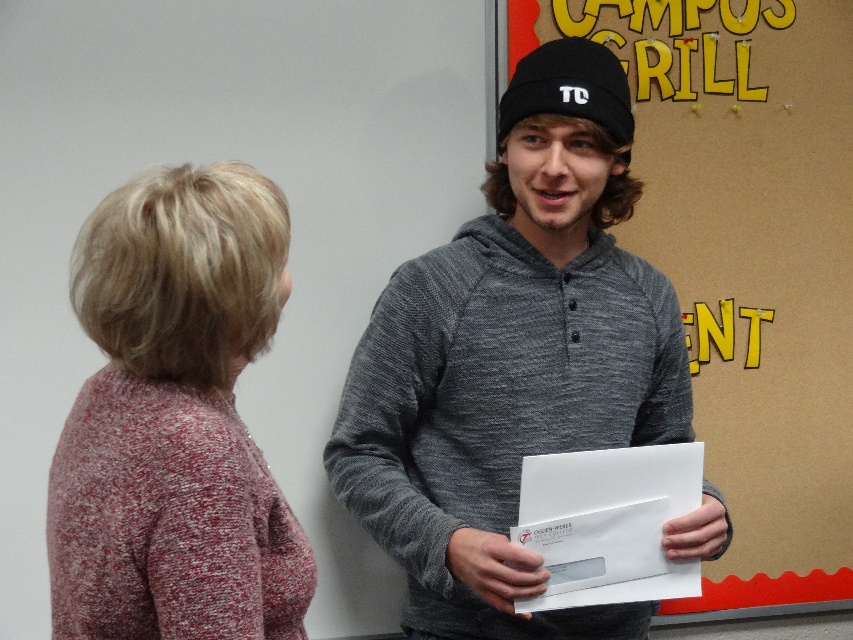 Jan Burton, Financial Aid manager, and Caleb Mecham, award recipient.