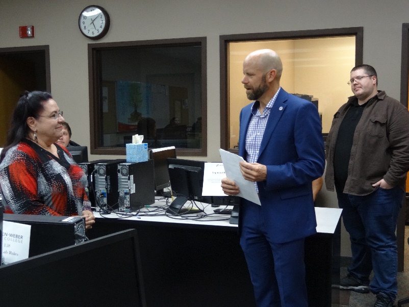 Dellana Herrera, award recipient, and Tyler Call, vice president for college services.